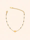 Bracciale Catena Dorata con Perline Nere e Cuore